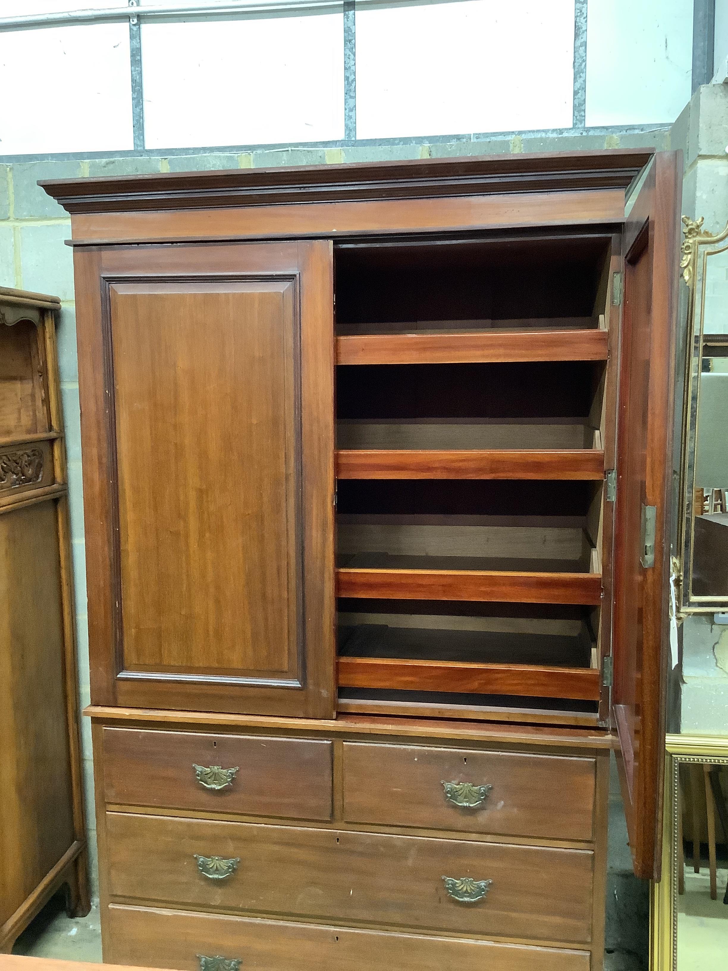 A late Victorian mahogany linen press, width 127cm, depth 55cm, height 203cm